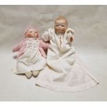 Two Bye-Lo bisque headed baby dolls by Grace Storey Putnam (1924-1925), each with sleeping brown
