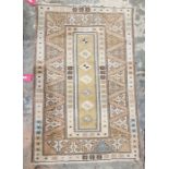 Anatolian Milas ochre ground rug with seven central lozenges, multiple geometric and floral