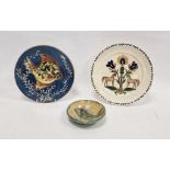 Two various continental slipware and lustre pottery dishes painted with fish and a plate painted