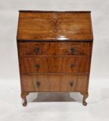 Reproduction mahogany and walnut veneered bureau with drop enclosing pigeonholes and drawers,