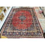 Northwest Persian red ground Birjand carpet with central floral medallion to floral field,