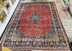 Northwest Persian red ground Birjand carpet with central floral medallion to floral field,