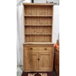 Pine dresser with shelves above drawers and cupboard below, 112cm wide
