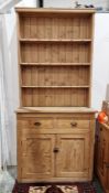 Pine dresser with shelves above drawers and cupboard below, 112cm wide