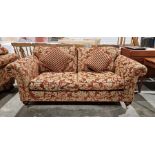 20th century red damask two-seater sofa on turned supports and castors