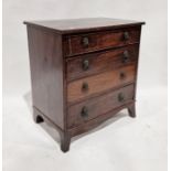 19th century mahogany chest of four long drawers with brass lion hoop handles, on splayed