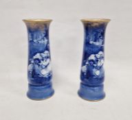 Pair of Royal Doulton blue and white Children's Series cylindrical vases each printed with