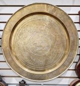 Large brass circular tray or table top, with oriental engraved decorations, featuring insects,