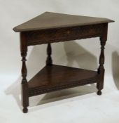 Carved oak corner occasional table with single frieze drawer, having lunette carving and undershelf