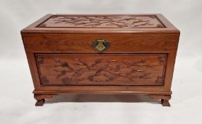20th century camphorwood Chinese chest with trays to inside, carved panel top and sides, on shaped