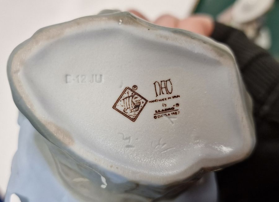 Five Lladro figures including a boy and girl riding a donkey, a pair of girls with baskets of - Image 3 of 10