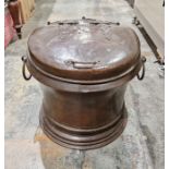 Large copper log bin, cylindrical with hinged lid having strapwork decoration, pair ring side