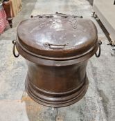 Large copper log bin, cylindrical with hinged lid having strapwork decoration, pair ring side