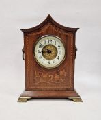 Early 20th century floral inlaid mahogany mantel clock in pointed arched case on brass stepped feet,