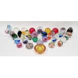 Quantity of glass paperweights to include Caithness 'Merry-Go-Round', an Avondale glass