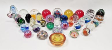 Quantity of glass paperweights to include Caithness 'Merry-Go-Round', an Avondale glass
