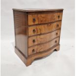 Reproduction walnut chest of four long drawers, on bracket feet, 84 cms h x 77cm wide x 50 cms