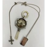 Silver and mother-of-pearl baby rattle, a silver ingot pendant on chain, 33.5g and a silver-coloured