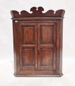 19th century mahogany corner cupboard with pair of panelled doors enclosing four shelves , 119 cms