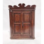 19th century mahogany corner cupboard with pair of panelled doors enclosing four shelves , 119 cms