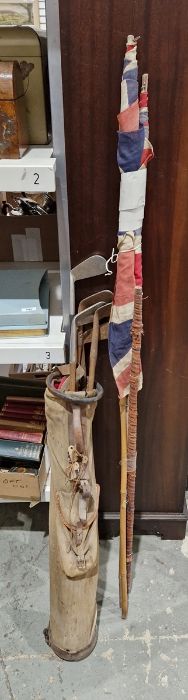 Bag of old golf clubs, two Union Jack flags on bamboo sticks Condition ReportFlags - H. 54 x  L.