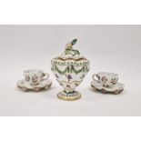 Two Meissen flower encrusted cabinet cups and saucers and a Continental porcelain lobed vase and