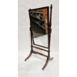 Mahogany cheval robing mirror, the rectangular plate with ebonised borders, on reeded uprights,