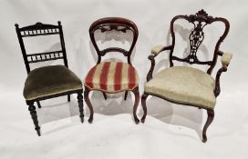 19th century mahogany carved open armchair with padded arm rests, upholstered seat, on cabriole
