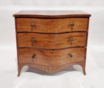George III mahogany serpentine-fronted chest of three graduated drawers with circular brass