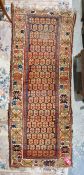 Eastern brown/blue ground runner the field with allover boteh pattern, geometric and floral border