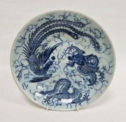 Chinese blue and white porcelain circular dish, printed and painted with dragons and phoenix amongst