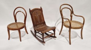 Child's bentwood and cane-seated chair, another child's bentwood cane-seated armchair and a child'