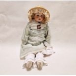 Bisque headed doll marked 'PM' with brown sleeping eyes, partly bisque and kid-covered body and