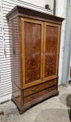 James Shoolbred, London, Edwardian mahogany wardrobe with floral, scroll and griffin inlaid