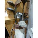 Assorted antique golf clubs in case