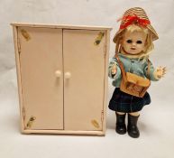 1950s/60s Pedigree schoolgirl doll with satchel and a painted wood wardrobe with clothes