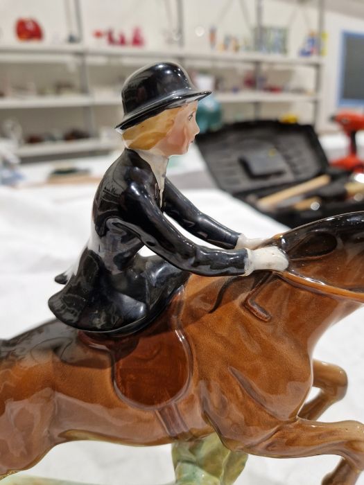 Beswick pottery model of a horse and rider jumping a fence, printed black marks, the female rider - Image 11 of 17