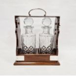 Polished wood and cut glass two bottle tantalus, silver plate mounts, 32cm high Condition