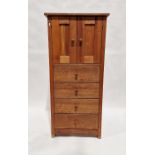 Modern lightwood cupboard with pair panelled doors above four long drawers, on straight supports,
