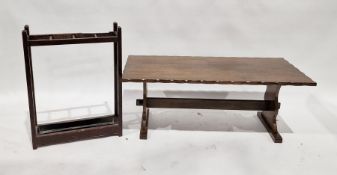 Stained wood stickstand, a stained wood rectangular coffee table, bookrests and a folding wooden