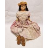 Georgian wax shoulderhead doll with fixed brown glass eyes, cloth body and leather forearms, 76cm