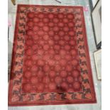 Modern Belgian Prado 'Royal Opera' red ground wool pile rug with five rows of eight and four rows of