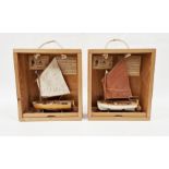 Small wooden model of Arthur Ransome Amazon boat and another of Swallow on wooden stand