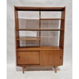 20th century teak wall unit with shelves above sliding doors, on tapering supports Condition