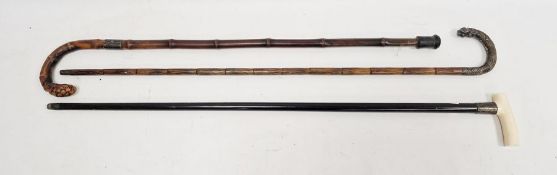 Silver-mounted bone handled ebonised walking cane, bamboo walking stick with silver collar and a