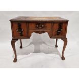 20th century mahogany kneehole desk with brown leather insert, on cabriole supports and claw and