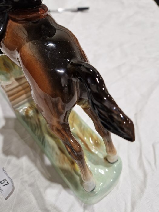 Beswick pottery model of a horse and rider jumping a fence, printed black marks, the female rider - Image 8 of 17