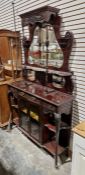 Edwardian mahogany mirror-backed sideboard with scroll shaped shelf flanked by baluster supports and