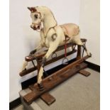 G. & J. Lines antique rocking horse on wooden base, dappled (in need of restoration). Height