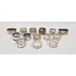 Fourteen assorted silver and silver-coloured napkin rings, various patterns, 9ozt total approx. (14)